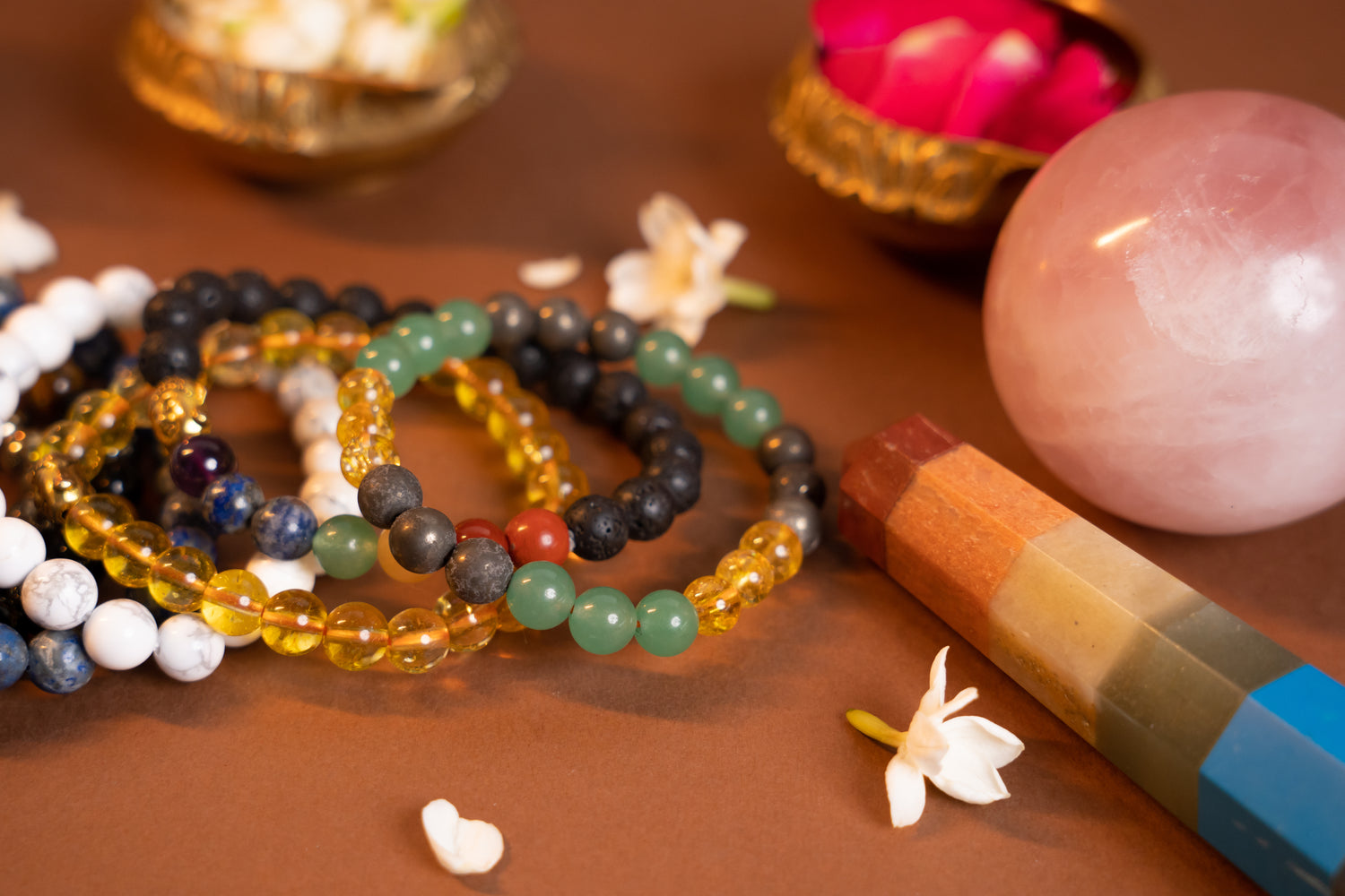 Multiple gemstone bracelets arranged together, radiating positive vibes and holistic balance.
