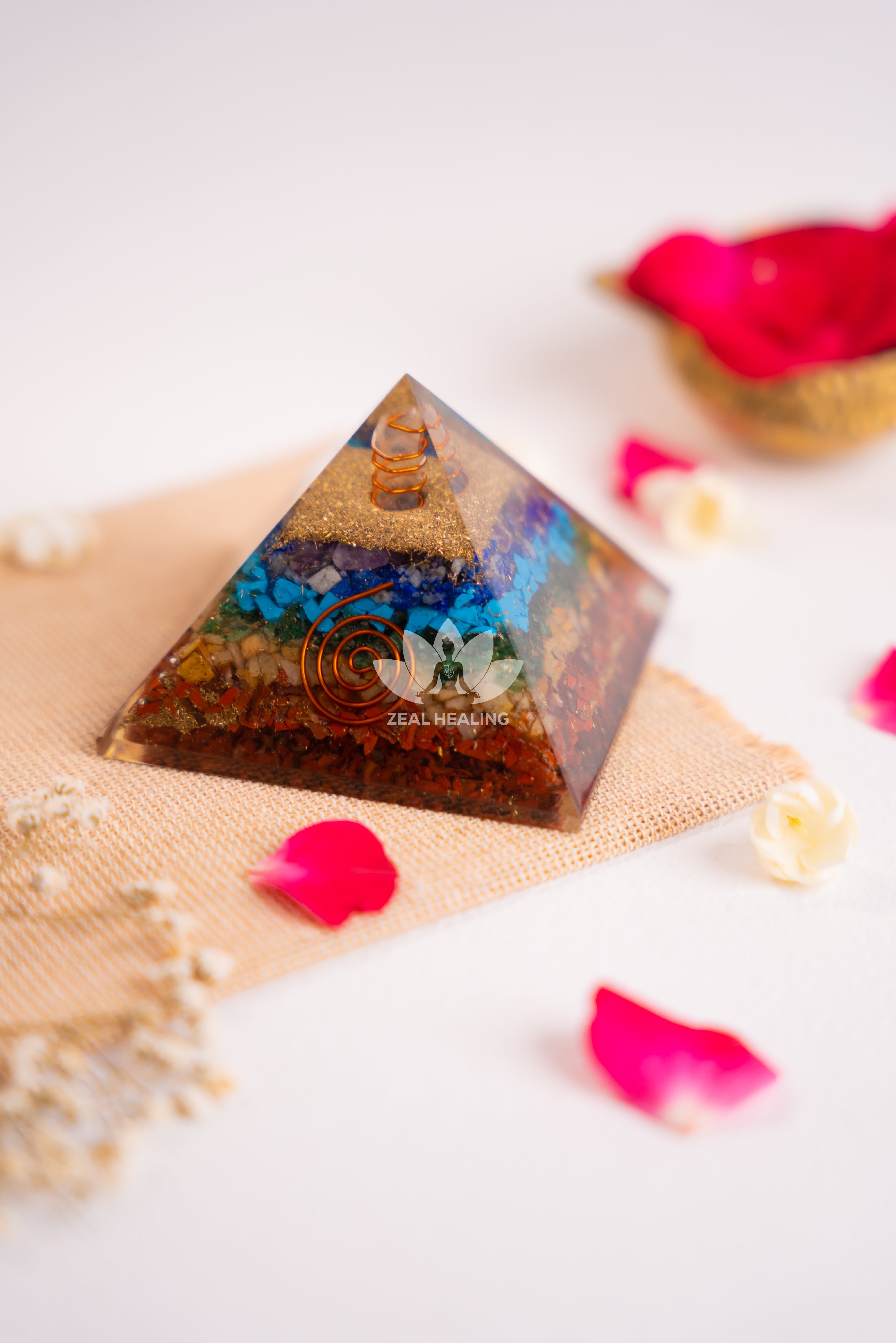 Layered crystal pyramid representing 7 chakras, radiating healing and harmony.