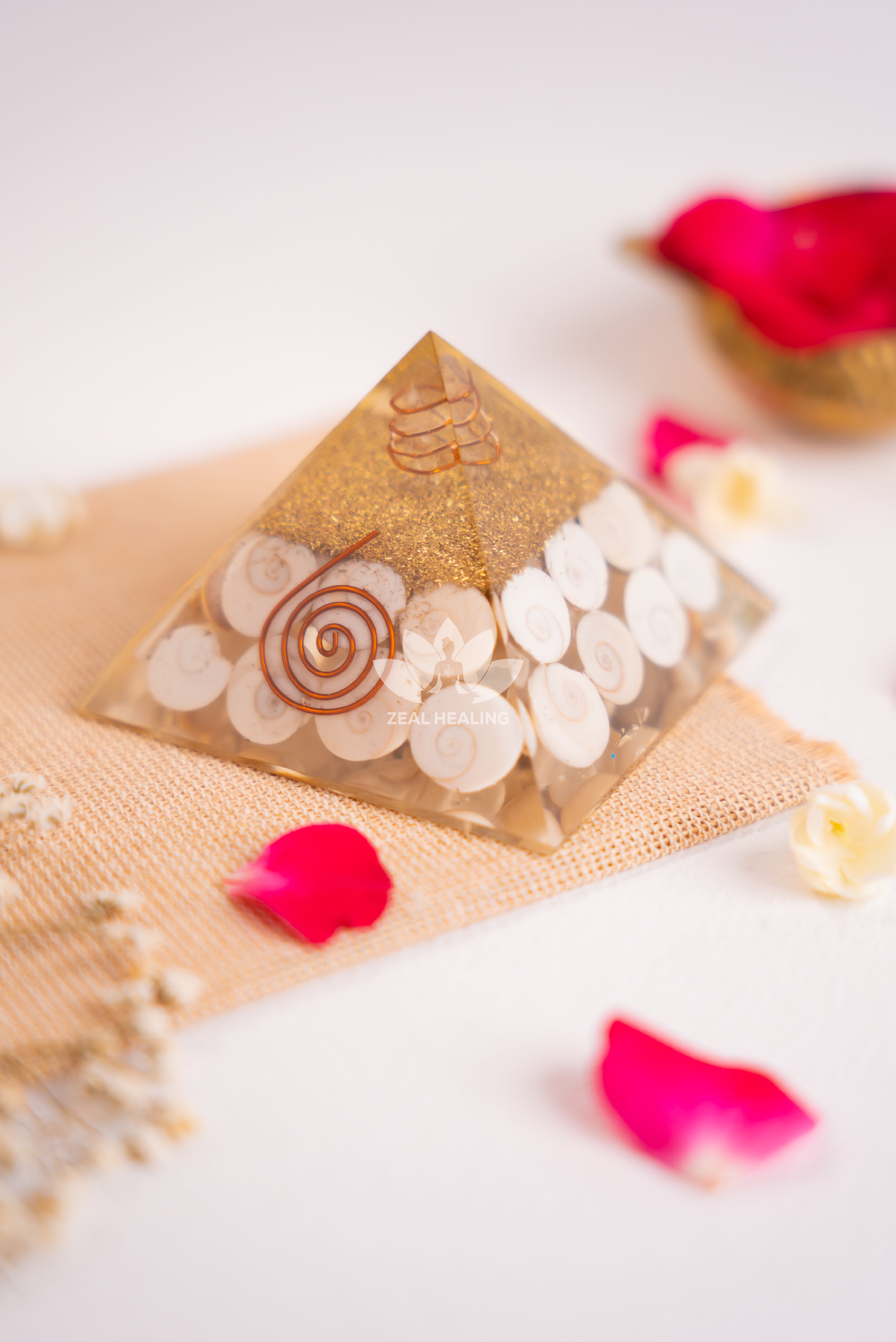 Polished pyramid with natural Gomathi Chakras, radiating sacred and calming energy.