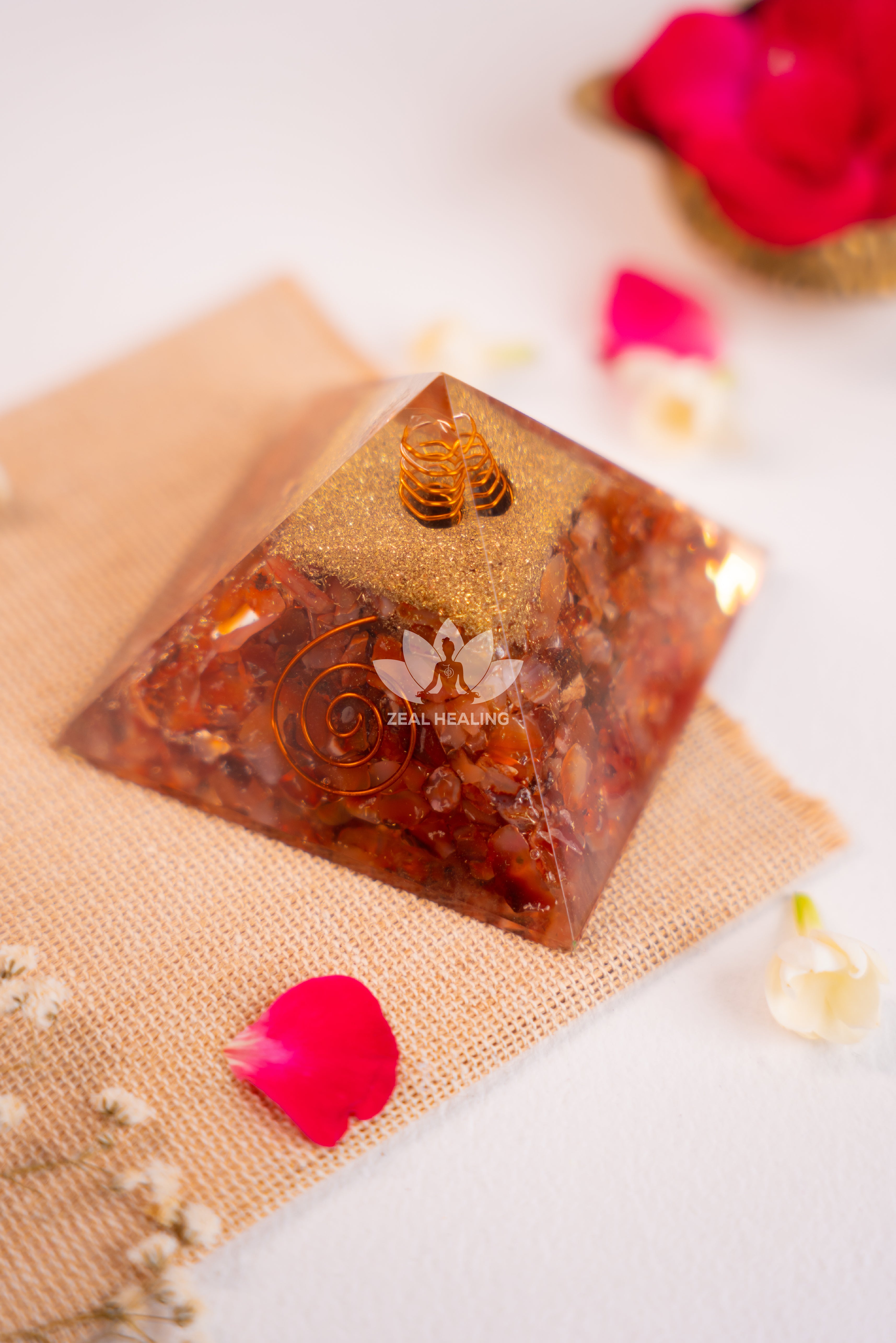 Polished Red Carnelian pyramid, radiating warmth and positive energy for confidence.