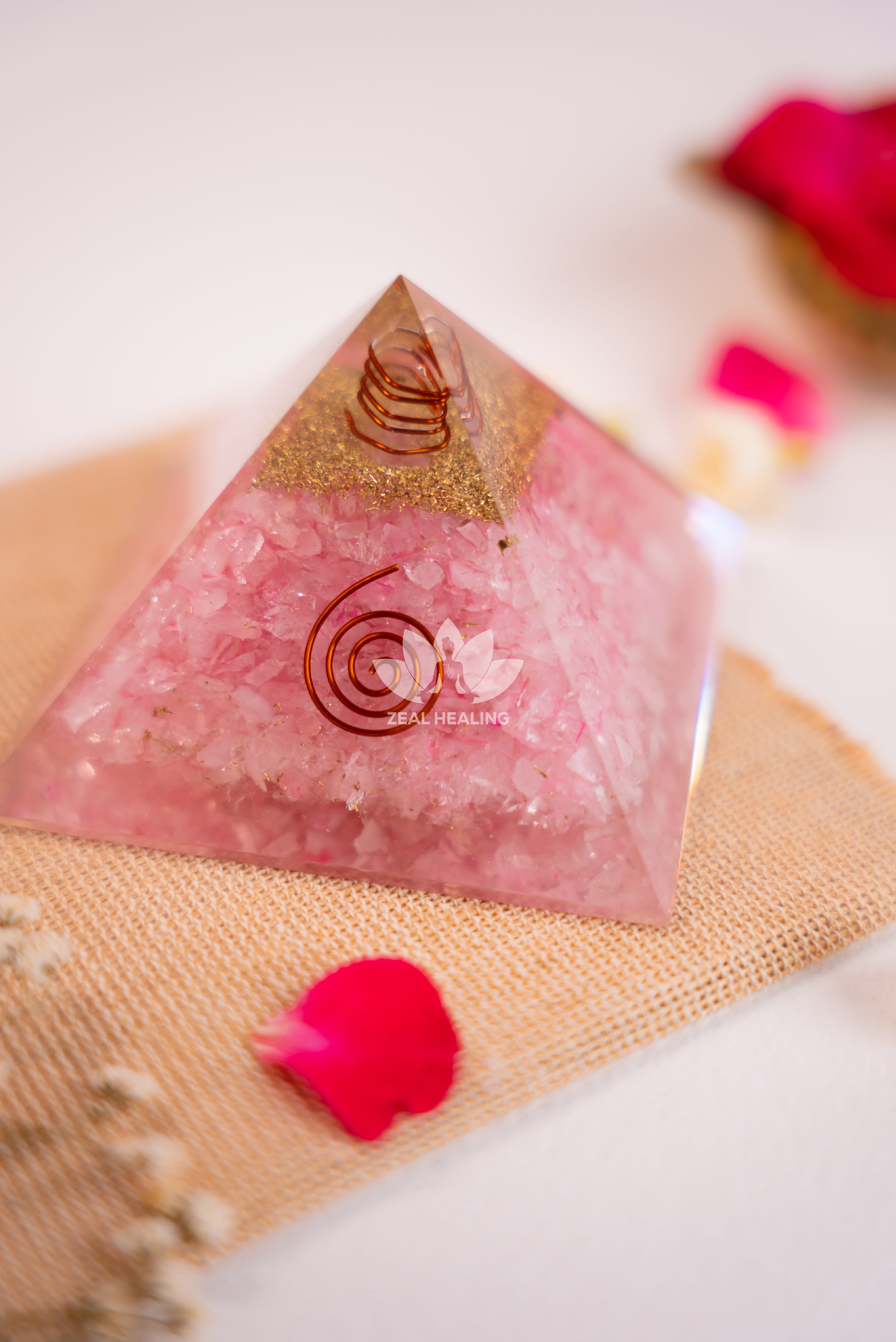 Polished Rose Quartz pyramid with gentle pink tones, radiating soothing positive vibes.